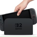 123669-nintendo-switch-2-docked-hand-taking-out-1200×675